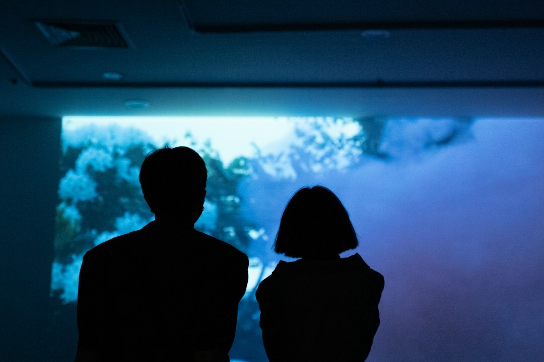 Executives reviewing digital data on a large screen